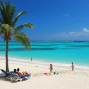 Family enjoying the beach in Punta Cana, highlighting the investment potential in Caribbean real estate